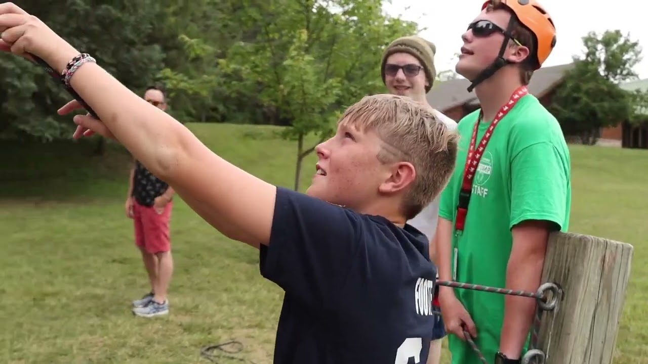 Iowa CYP mentor cheering with youth during a Guard family event