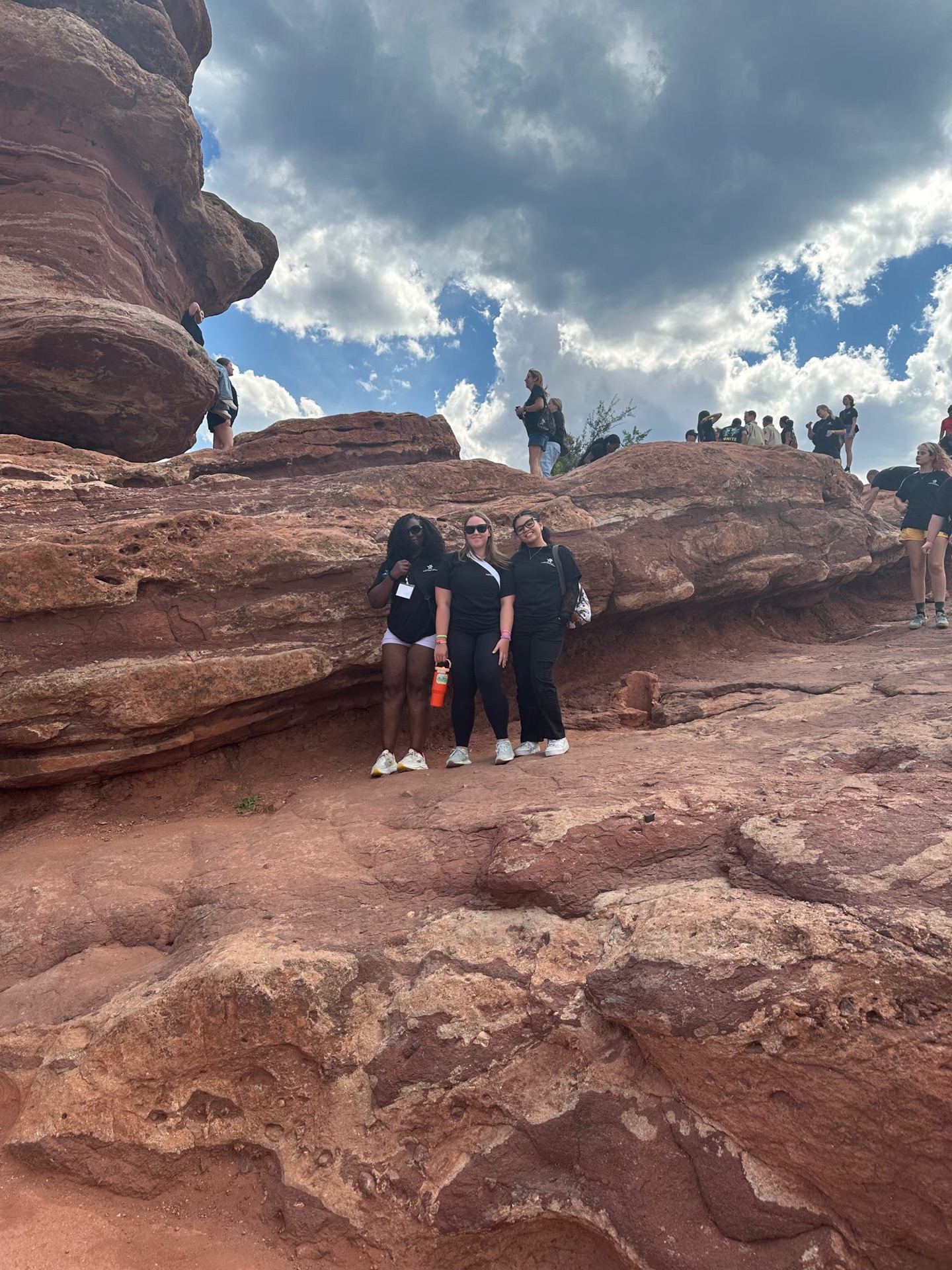 Charlee and fellow youth delegates visiting a red rock landmark