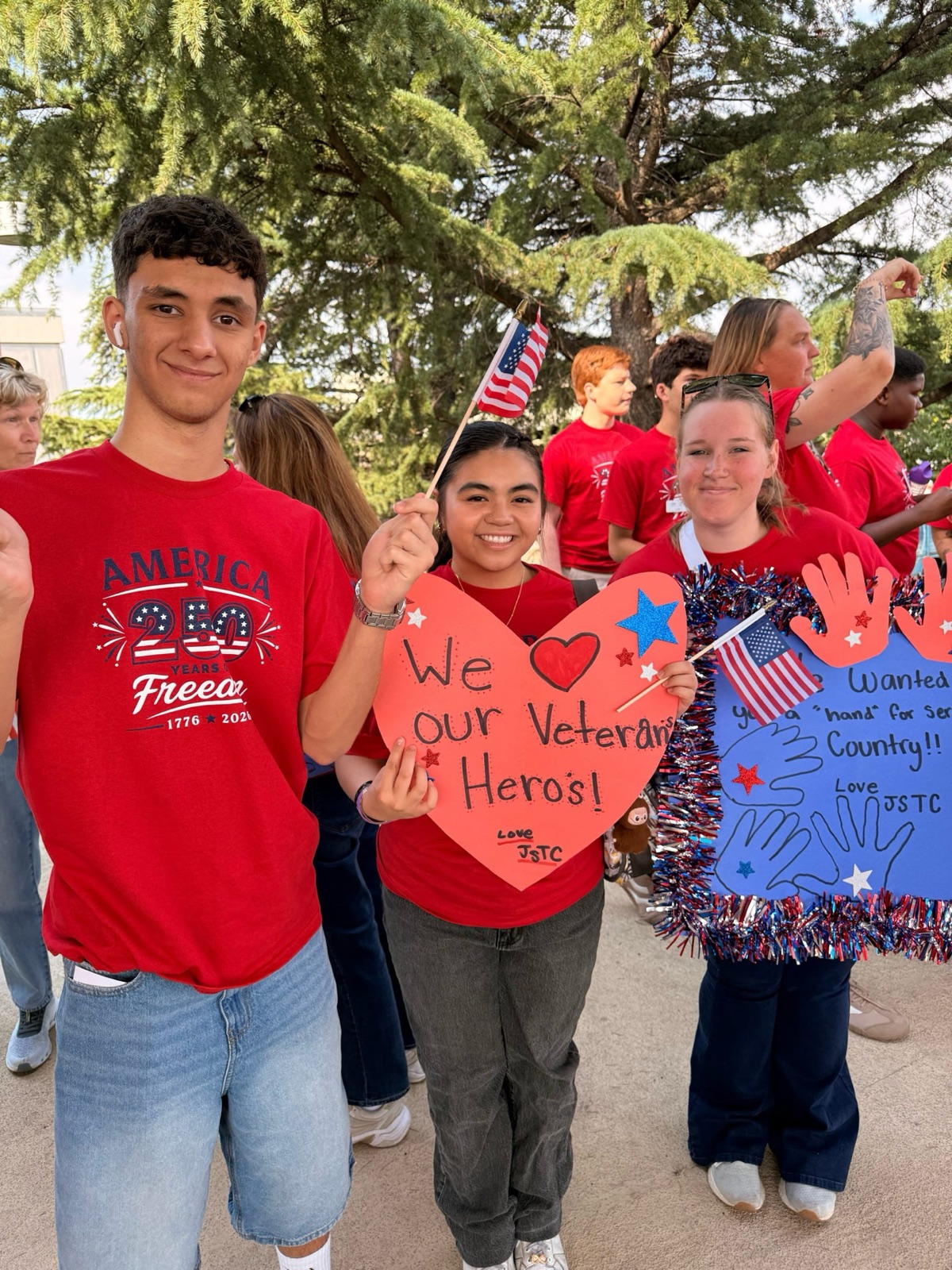 Military-connected youth honoring veterans at a patriotic community event