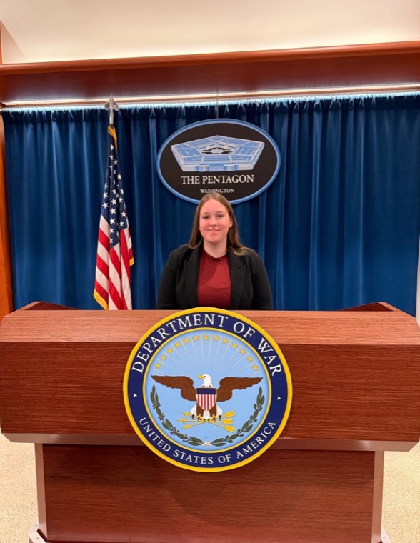 Charlee Cromwell at the Pentagon briefing podium in Washington, D.C.