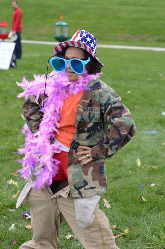 Volunteer cheering alongside Guard-connected youth during a CYP activity